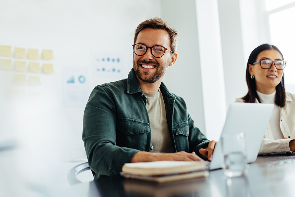 Employee smiling in a meeting